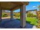 Inviting backyard featuring manicured lawn, landscaped garden beds, and a covered patio area for outdoor living at 880 Cirrus Cloud Ave, Las Vegas, NV 89138
