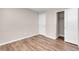 Neutral bedroom with light wood floors, closet, and door at 880 Cirrus Cloud Ave, Las Vegas, NV 89138
