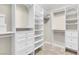 Walk-in closet with custom white shelving and drawers providing ample storage space at 880 Cirrus Cloud Ave, Las Vegas, NV 89138