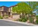 Charming two-story home with beautiful landscaping and a driveway at 880 Cirrus Cloud Ave, Las Vegas, NV 89138
