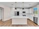 Modern kitchen with white cabinets, stainless steel appliances, and a large island at 880 Cirrus Cloud Ave, Las Vegas, NV 89138
