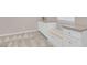 Mud room with built-in seating, storage cabinets, and a countertop for organization at 880 Cirrus Cloud Ave, Las Vegas, NV 89138