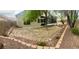 Backyard featuring a trampoline and easy care desert landscaping, creating a perfect outdoor retreat at 8928 Reining Spur Ave, Las Vegas, NV 89143