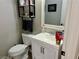 Well-lit bathroom featuring a modern vanity, decorative mirror, and stylish fixtures, enhancing the space at 8928 Reining Spur Ave, Las Vegas, NV 89143