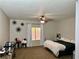 Bedroom with neutral walls, and a window creating a peaceful retreat for rest and rejuvenation at 8928 Reining Spur Ave, Las Vegas, NV 89143