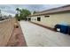 Expansive driveway showcasing ample parking and storage space, set against a neatly landscaped yard at 8928 Reining Spur Ave, Las Vegas, NV 89143