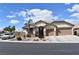 Charming single-story home with a desert landscape, two-car garage, and inviting curb appeal at 8928 Reining Spur Ave, Las Vegas, NV 89143