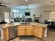 Stylish kitchen with granite counters, stainless steel appliances, and open view of the living room at 8928 Reining Spur Ave, Las Vegas, NV 89143