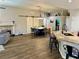 Open-concept kitchen and dining area with wood floors and plenty of natural light at 8928 Reining Spur Ave, Las Vegas, NV 89143
