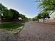 Community park with walking path, mature trees, and green space, perfect for recreation and relaxation at 8928 Reining Spur Ave, Las Vegas, NV 89143