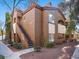 Charming two-story condo with stucco exterior, tile roof, private balcony, and landscaped grounds, offering comfortable living at 9000 Las Vegas Blvd # 2061, Las Vegas, NV 89123