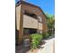 Exterior elevation of a condo with a private balcony, desert landscaping, and stucco finish at 9000 Las Vegas Blvd # 2097, Las Vegas, NV 89123