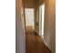 Hallway featuring hardwood floors and neutral paint, leading to other rooms in the home at 9000 Las Vegas Blvd # 2097, Las Vegas, NV 89123