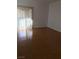 Laminate floor in a light-filled living room with a sliding glass door at 9000 Las Vegas Blvd # 2097, Las Vegas, NV 89123