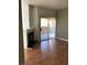 Bright living room with fireplace and sliding glass doors to balcony, and laminate wood floors at 9000 Las Vegas Blvd # 2097, Las Vegas, NV 89123