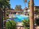 Community pool surrounded by lush landscaping and comfortable lounge chairs for relaxation at 9000 Las Vegas Blvd # 2097, Las Vegas, NV 89123