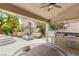 Enjoy outdoor living in this backyard with a built in barbecue, seating area, and manicured landscaping at 9615 Sedona Hills Ct, Las Vegas, NV 89147