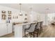 Stylish home bar with marble countertops, wine racks, pendant lighting, and comfortable seating at 9615 Sedona Hills Ct, Las Vegas, NV 89147