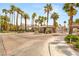 Gated community entrance lined with palm trees providing security and curb appeal at 9615 Sedona Hills Ct, Las Vegas, NV 89147