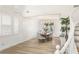 Bright dining room with high ceilings, wainscoting, large windows, and modern light fixture at 9615 Sedona Hills Ct, Las Vegas, NV 89147