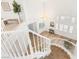 Bright two-story home entryway with curved staircase, light-colored wood floors, and decorative chandelier at 9615 Sedona Hills Ct, Las Vegas, NV 89147