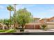 Traditional two-story home featuring a three-car garage, well-maintained landscaping, and a welcoming facade at 9615 Sedona Hills Ct, Las Vegas, NV 89147