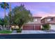 Charming two-story home with a three-car garage and mature landscaping at 9615 Sedona Hills Ct, Las Vegas, NV 89147