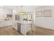 Charming kitchen with a large island, stainless steel appliances, and a cozy dining nook at 9615 Sedona Hills Ct, Las Vegas, NV 89147