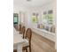 Bright kitchen nook with built-in seating, modern windows, and a view of the backyard at 9615 Sedona Hills Ct, Las Vegas, NV 89147
