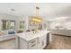 Open kitchen with a large island, stainless steel appliances, and view of the living room at 9615 Sedona Hills Ct, Las Vegas, NV 89147