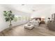Spacious main bedroom featuring shuttered windows, wood-look floors, contemporary decor, and ceiling fan at 9615 Sedona Hills Ct, Las Vegas, NV 89147