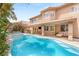 Beautiful backyard with a sparkling pool, spa, built-in grill, and spacious patio at 9615 Sedona Hills Ct, Las Vegas, NV 89147