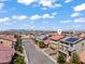 An aerial view of a two-story home showcasing its surroundings and neighborhood with mountains in the horizon at 9742 Toad Hollow St, Las Vegas, NV 89141