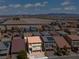 Aerial shot of a beige two-story home with a balcony in a desert neighborhood at 9742 Toad Hollow St, Las Vegas, NV 89141