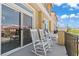 Cozy balcony with comfortable rocking chairs, offering a relaxing outdoor space at 9742 Toad Hollow St, Las Vegas, NV 89141