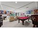 Spacious basement game and media room featuring a pool table and home theater seating at 9742 Toad Hollow St, Las Vegas, NV 89141