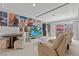 Basement media room features theater chairs, TV, posters and backyard access at 9742 Toad Hollow St, Las Vegas, NV 89141