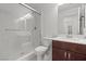 Bathroom boasts a glass shower, tile, and dark wooden cabinets at 9742 Toad Hollow St, Las Vegas, NV 89141