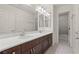 Bathroom showcasing a dual sink vanity with a white countertop at 9742 Toad Hollow St, Las Vegas, NV 89141