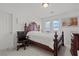 Bright bedroom featuring a wood bed frame, dresser, and bright windows at 9742 Toad Hollow St, Las Vegas, NV 89141