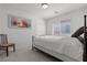 Bedroom featuring a black metal bed frame, carpet, neutral colored walls, and a picture at 9742 Toad Hollow St, Las Vegas, NV 89141