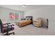 Bright bedroom with plush carpeting, a recliner, and plenty of natural light at 9742 Toad Hollow St, Las Vegas, NV 89141