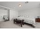 Spacious bedroom featuring a king bed, sitting chair, and neutral decor at 9742 Toad Hollow St, Las Vegas, NV 89141