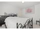 Modern bedroom design featuring a stylish iron bed frame and minimalist decor at 9742 Toad Hollow St, Las Vegas, NV 89141