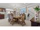 Elegant dining area featuring a large table, ornate chairs, chandelier, and decorative artwork at 9742 Toad Hollow St, Las Vegas, NV 89141