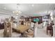 Spacious dining room with ornate chairs, a large table, and views into the living area at 9742 Toad Hollow St, Las Vegas, NV 89141