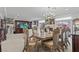 Open concept dining room with ornate furniture, a chandelier, and views into the living area at 9742 Toad Hollow St, Las Vegas, NV 89141