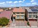 View of a two-story home with a charming balcony and a well-manicured front yard and a red tile roof at 9742 Toad Hollow St, Las Vegas, NV 89141