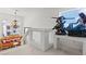 Stylish loft space with unique mermaid decor, elegant chandelier, and cozy orange seating at 9742 Toad Hollow St, Las Vegas, NV 89141