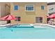 Backyard pool and spa with patio umbrellas, connected to the home at 9742 Toad Hollow St, Las Vegas, NV 89141
